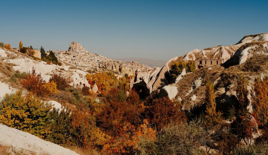 Old Cappadocia Culture - a rocky hillside with trees and bushes