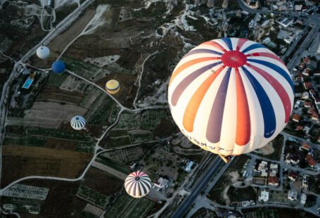 Authentic Local Hospitality Cappadocia - white and blue hot air balloon floating on city