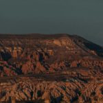 Turkish Rugs Cappadocia - brown rock formation under gray sky during daytime