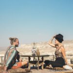 Affordable Lodging Göreme - a man and a woman sitting on the ground