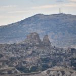 Hidden Treasures Cappadocia - a mountain with a city on top of it