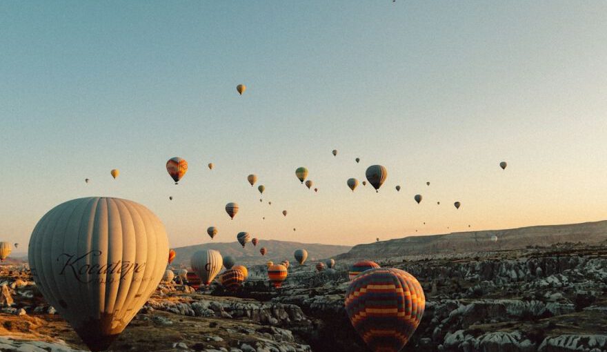 Local Celebrations Cappadocia - hot air balloons flying over the field during daytime