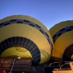 Boutique Wineries Vineyards Cappadocia - a couple of hot air balloons sitting next to a truck