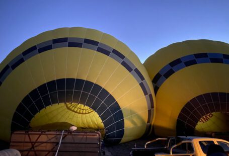Boutique Wineries Vineyards Cappadocia - a couple of hot air balloons sitting next to a truck