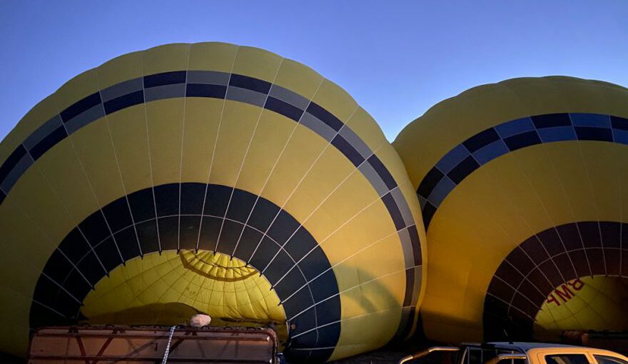 Boutique Wineries Vineyards Cappadocia - a couple of hot air balloons sitting next to a truck