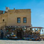 Cappadocia Souvenirs - people walking on beach near brown concrete building during daytime