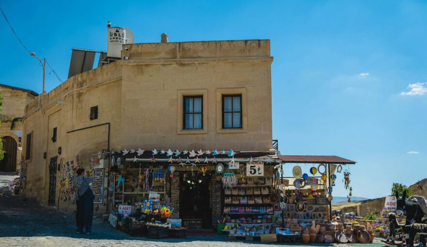 Cappadocia Souvenirs - people walking on beach near brown concrete building during daytime