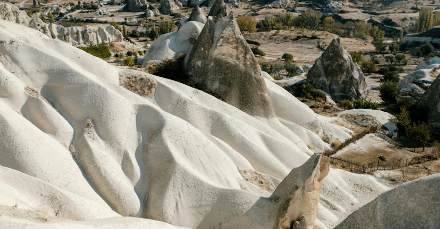 Scenic Hikes Cappadocia - Scenery view of massive rocky formation with smooth curvy slopes located on highlands with many rough volcanic peaks in Cappadocia