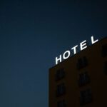 Cave Hotel Selection Cappadocia - low-angle photo of Hotel lighted signage on top of brown building during nighttime