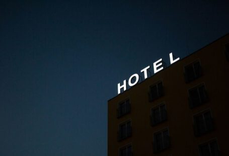 Cave Hotel Selection Cappadocia - low-angle photo of Hotel lighted signage on top of brown building during nighttime