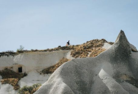 Hiking In Cappadocia - a person standing on a hill