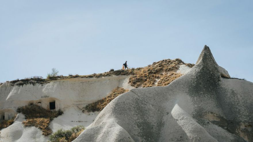 Hiking In Cappadocia - a person standing on a hill