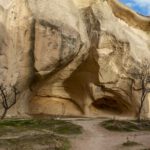Christianity Influence Cappadocia - a large rock formation with trees growing out of it