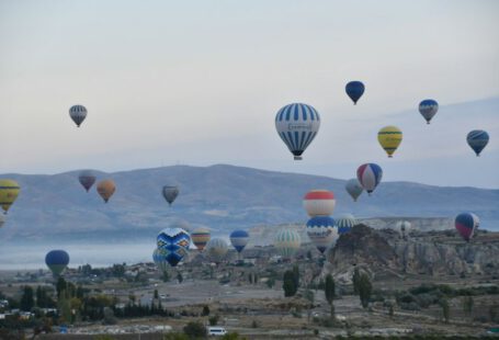 Cappadocia Whirling Dervishes - a bunch of hot air balloons flying in the sky