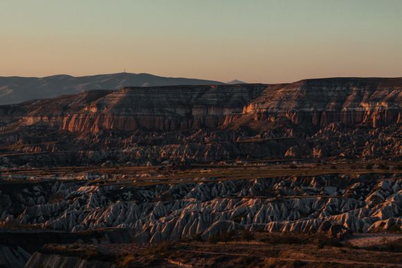 Cappadocia Chimneys - brown rocky mountain under gray sky during daytime