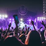 Festival - group of people raising there hands in concert