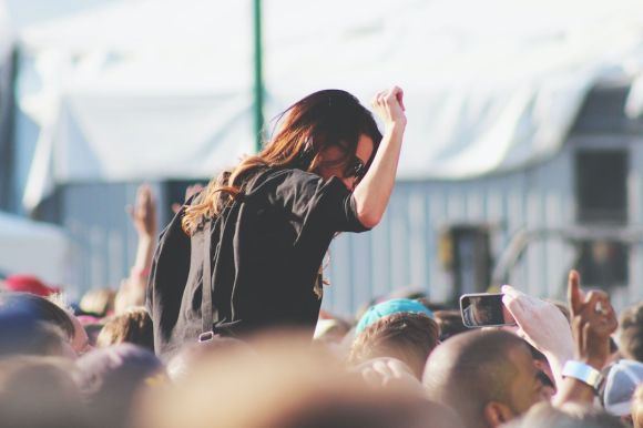 Festival - woman on top of crowd