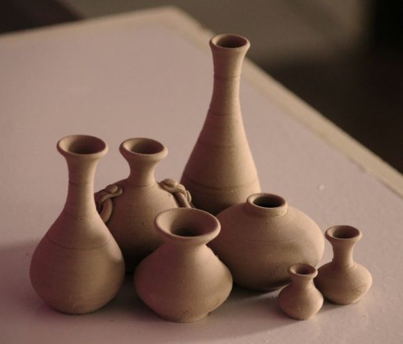 Pottery - white clay vases on table