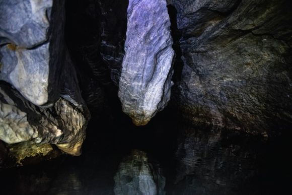 Cave Exploration - a small pool of water in a cave