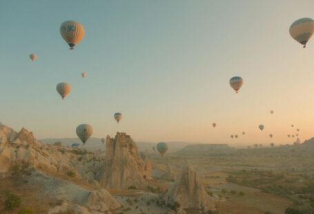 Göreme - a bunch of hot air balloons flying in the sky