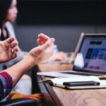 Meeting - black smartphone near person