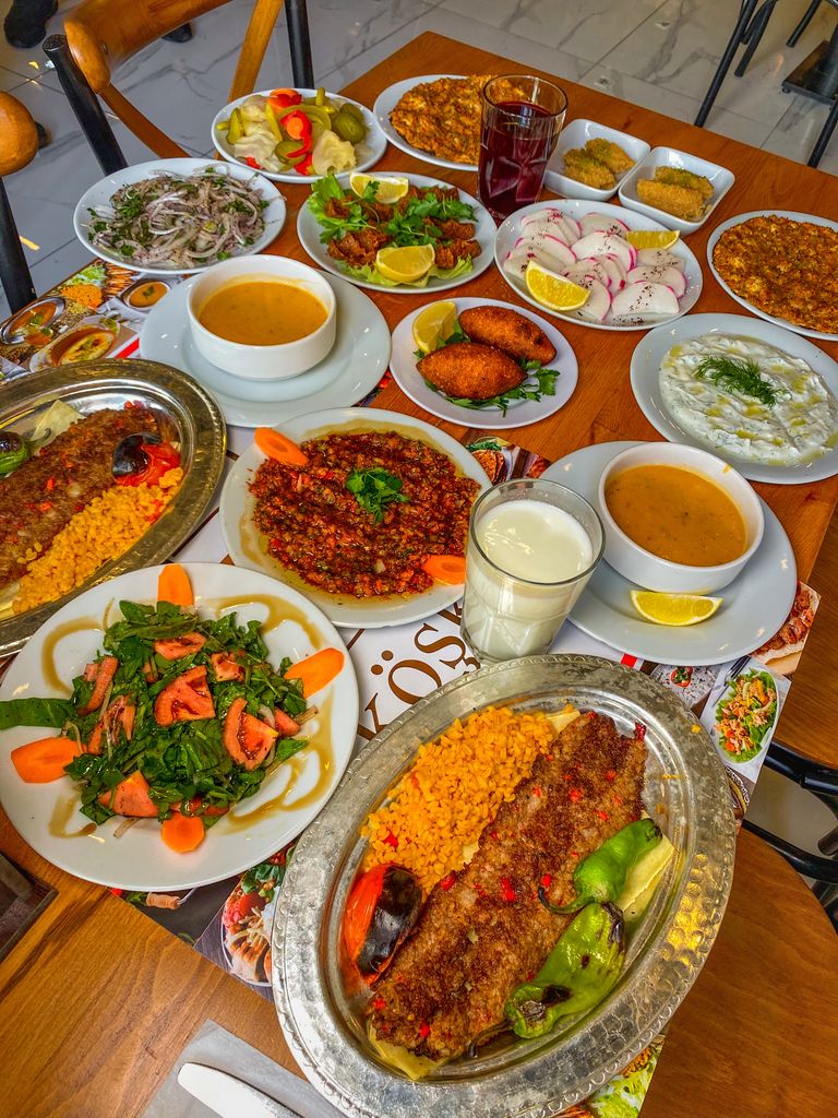A vibrant spread of traditional Turkish dishes on a wooden table capturing the essence of Middle Eastern cuisine.